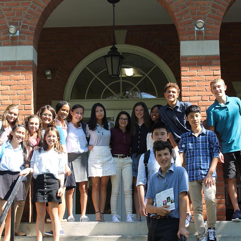 A group of future Chase Collegiate students pose outside while on a tour of the campus.