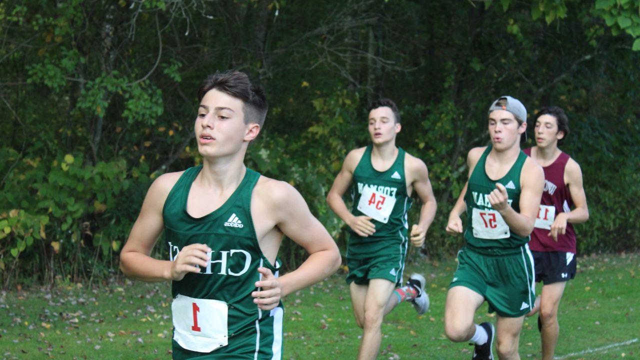 COLBY CALABRESE CHASE COLLEGIATE IN FRONT OF TWO FORMAN SCHOOL RUNNERS AT HVAL INVITE.JPG